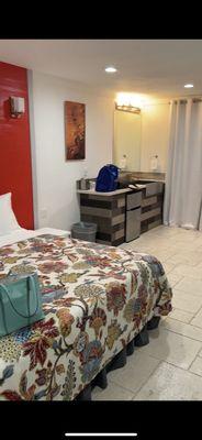 King size bed and small kitchen/sink , very spacious