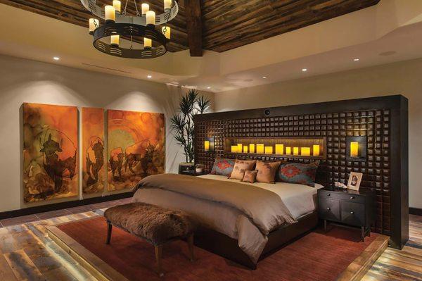 Bedroom with buffalo fur bench, buffalo leather pillows, and buffalo painting from Buffalo Collection