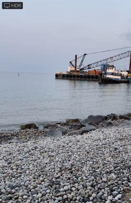 No beach, just rocks and industrial crane