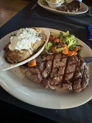 12oz Ribeye with loaded baked potato and roasted vegetables