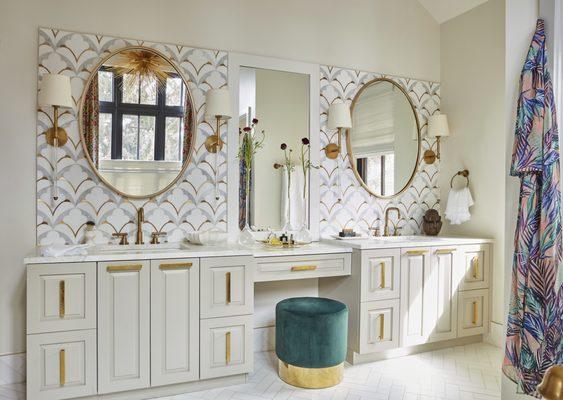 Lavish, light and bright primary bathroom design.