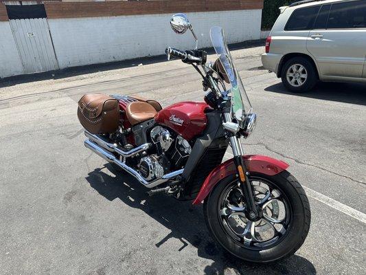 This awesome INDIAN bike belongs to a girl that pulls up alongside where I was parked.