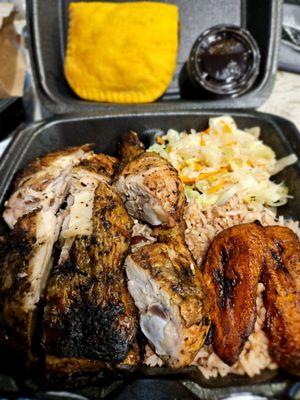 Jerk Chicken plate with cabbage, plantains, and rice and beans.  Also a beef patty on top.