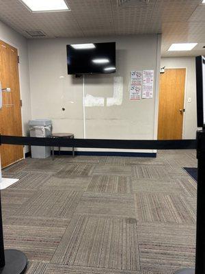 Dirty unfinished dry wall and stains on carpet in this "health" facility