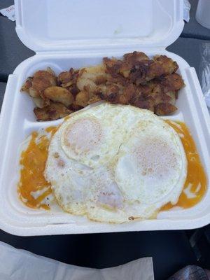 Country Biscuits w/gravy, cheese, eggs and home fries