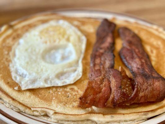 Special of the day for $11: large blueberry pancake, one egg and your choice of meat.