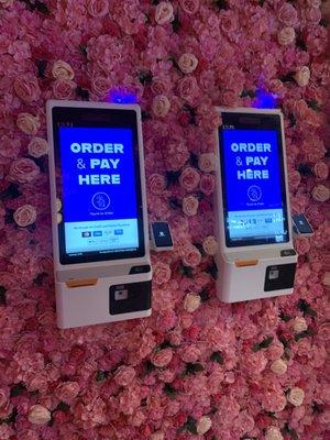 You pay using these kiosks, no cash payments