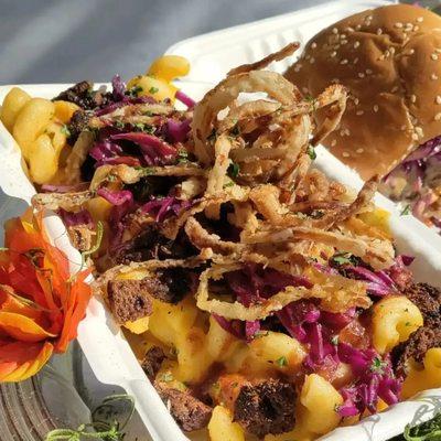 Chill P's loaded Mac N Cheese Butternut squash mac and cheese loaded with fried onions red cabbage and a drizzle of BBQ sauce