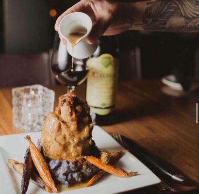 SLOW COOKED PORK SHANK* (gf) creamy polenta, natural jus, asparagus