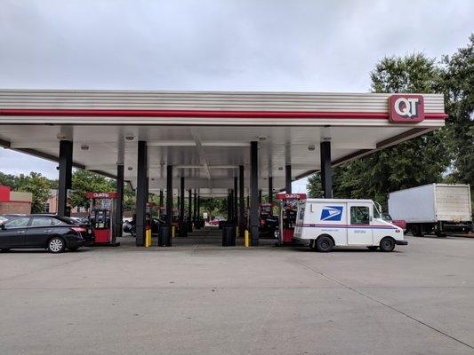 Outside the gas station. This gas station has 24 pumps. They are a mix between old pumps and new pumps. First time I've seen that at a QT.