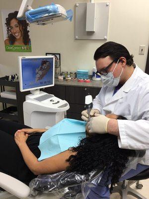 Dr. Weiner scanning a patient with CEREC camera and software to fabricate a one visit crown restoration.