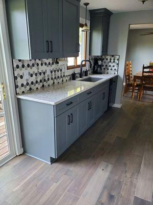 love the painted maple cabinets with tile backsplash