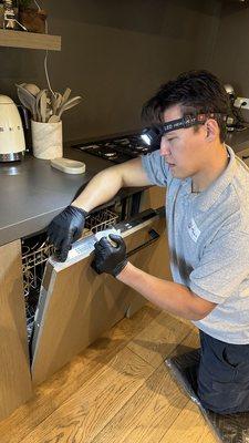 Mark is working on Miele dishwasher