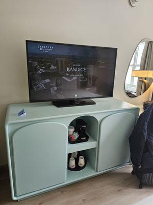 Love the vibe of this piece of furniture. Fridge on left, empty shelves on right. Coffee station & ice bucket.