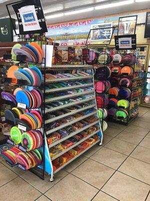 3 racks of Disc golf accessories