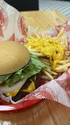 TPL cheeseburger combo, ketchup, mustard , tomato and lettuce, medium cheese fries.