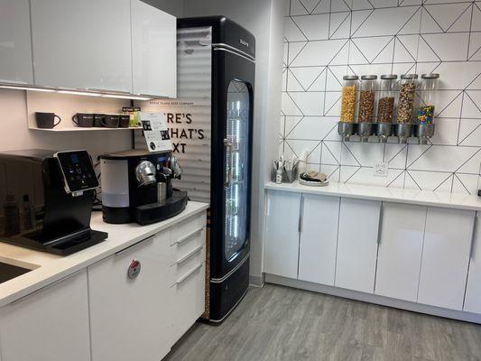 Kitchen with coffee, water, snacks