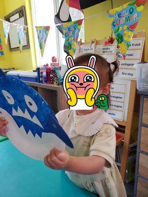 Making shark face mask and learning songs