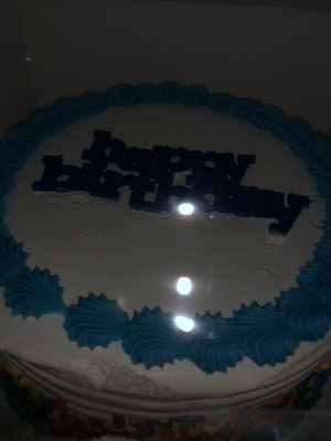 Birthday cake in low lighting