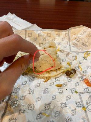 Literally a STAPLE! Or some sort of metal piece in my burrito! I hate this place. And management sucks.