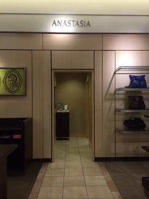 Entrance between the handbags and accessories on the bottom floor. To your right when you enter from the mall.