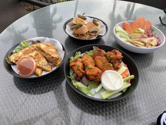 Pork sliders and quesadilla, Buffalo wings, hummus platter.