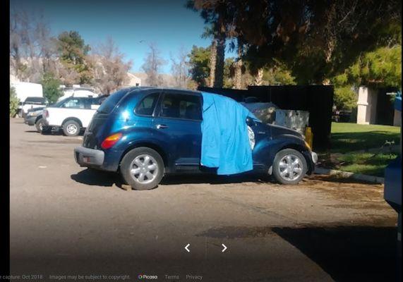 here it is, parked away from everyone. Towing is right around the corner. I put the tarp up because of pine needles.