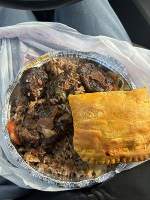 Oxtail, rice and beans, cabbage, & beef patty.