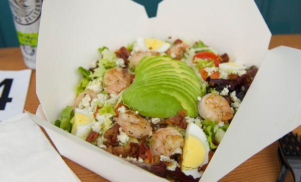 Seared shrimp Cobbb salad;Seared shrimp, mixed greens, avocado, hard boiled egg, tomato, blue cheese and bacon w/ honey  mustard