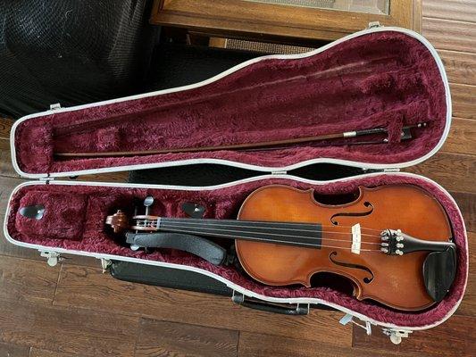 Restrung violin and bow with new purple hair