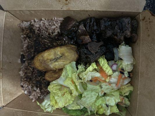 Ox tail, rice and peas with ox tail sauce, 2 plantains and salad (no dressing)