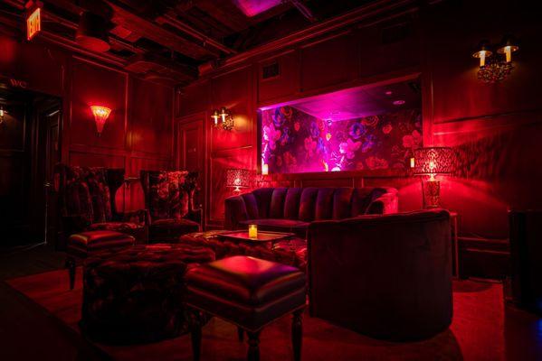 Experience a world of intrigue and charm at the speakeasy hidden beneath the Ivory Peacock Bar.