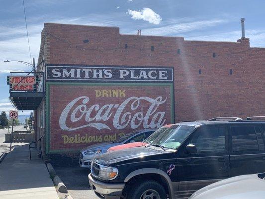 Classic wall sign and neon makes it easy to find at morning or night