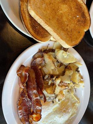 2 eggs 2 bacon.Home fries.Toast. Less than 6 bucks