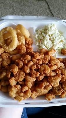 Popcorn shrimp, hush puppies, onion rings, and Coleslaw.