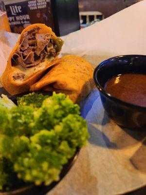 French dip in a wrap. Philly cheesesteak does NOT come with au jus