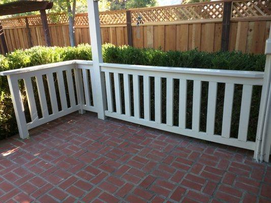 Replaced rotted slats and painted railing