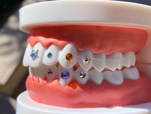 Available gems. Make any design you choose and tooth placement. Book Now!!!