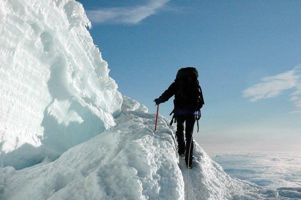 Maria crossing snow bridge on the Mt. Rainier Climb For Clean Air.