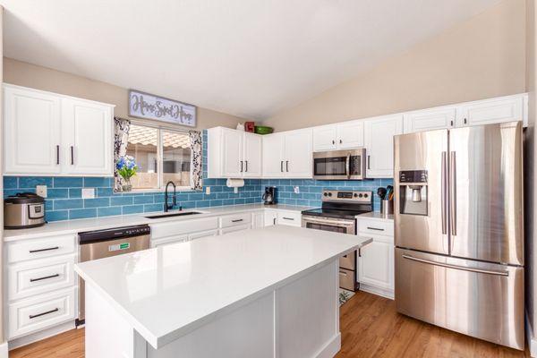 The after - backsplash and flooring came from Floor and Decor