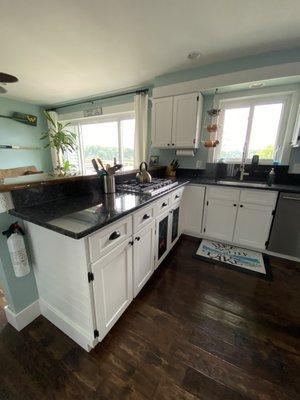 Steel gray polished on white cabinets with black hardware