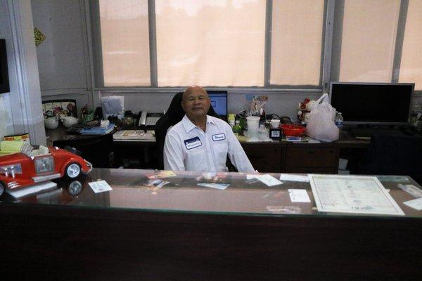 Wenson Quach behind the desk.