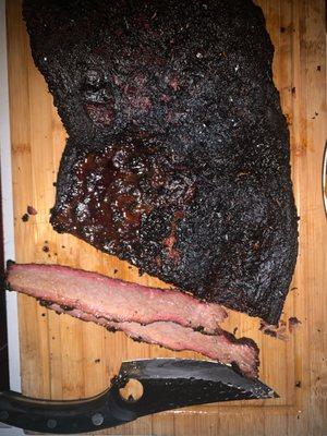 Slow smoked brisket ...aji panka and aji mirasol dry rub with black and white pepper hydrate with apple juice and a little mezcal