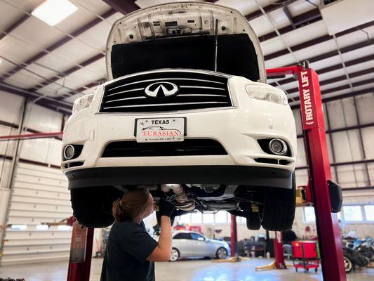 ASE Master tech working on infinity car repair