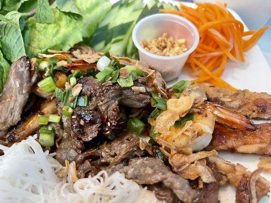 The lemongrass beef up-close. (Fine Vermicelli Grilled shrimp , Chicken, Lemongrass Beef.)