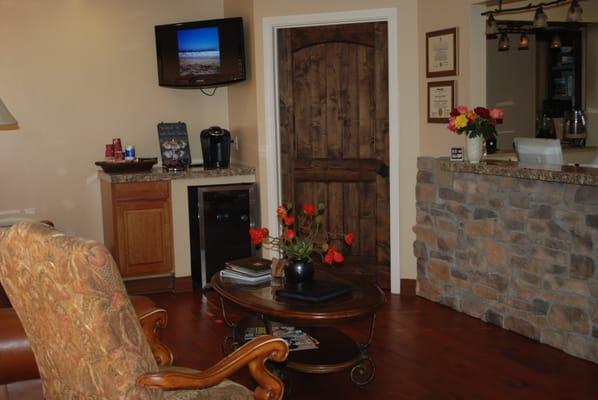 Reception area with juice and coffee bar for patients to enjoy.