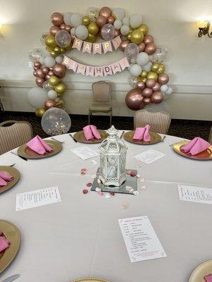 Lanterns and mirrors borrowed from venue as centerpieces.