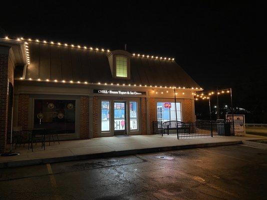 nighttime exterior photo. winter holiday lights adding cheer!