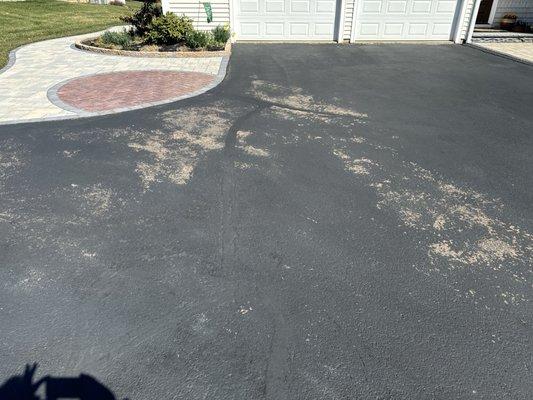 Driveway with SealPro black top coating loss