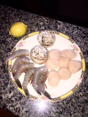 Salmon, mushrooms, and scallops. See lemon for scale --- the picture does not do it justice!